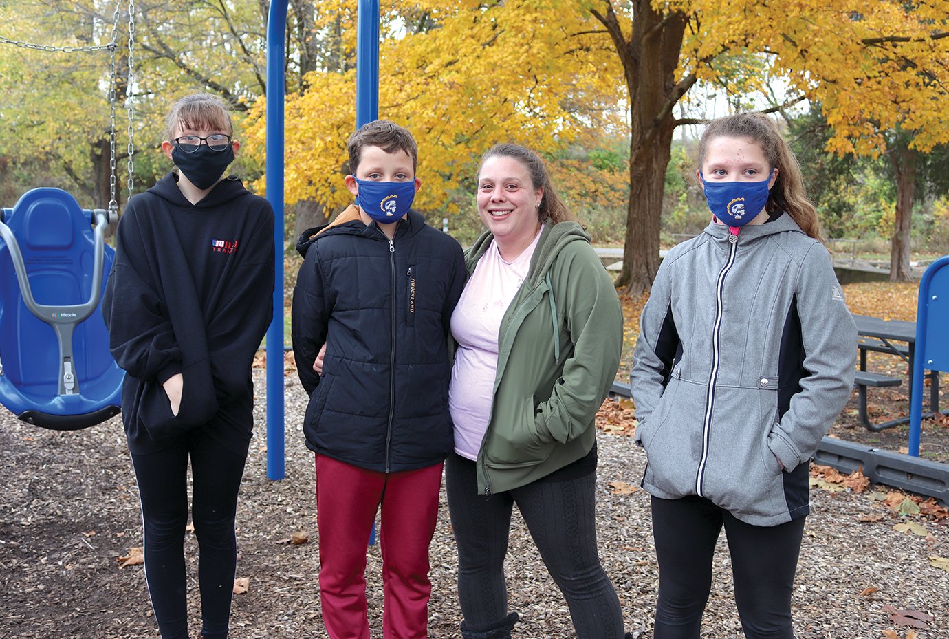 Members of the Mantesta family, including Olivia, from left, Gavin, Kristen and Alyssa defy chilly temperatures by socially distancing themselves outdside Wednesday at Milligan Park.